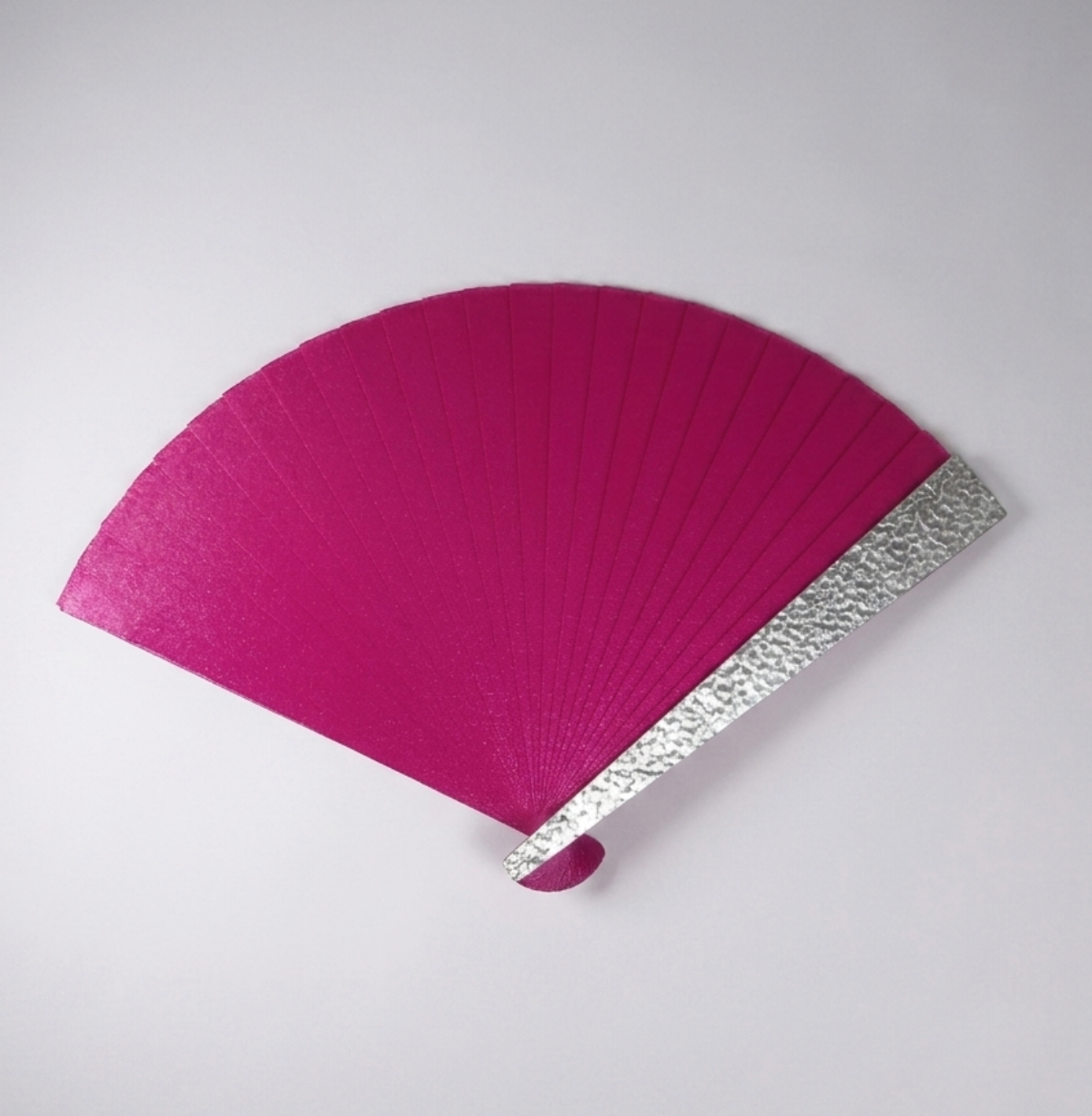 Pink hand fan with silver decorative edge made in Paris